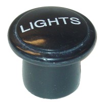 Knob for light switch. Says Light