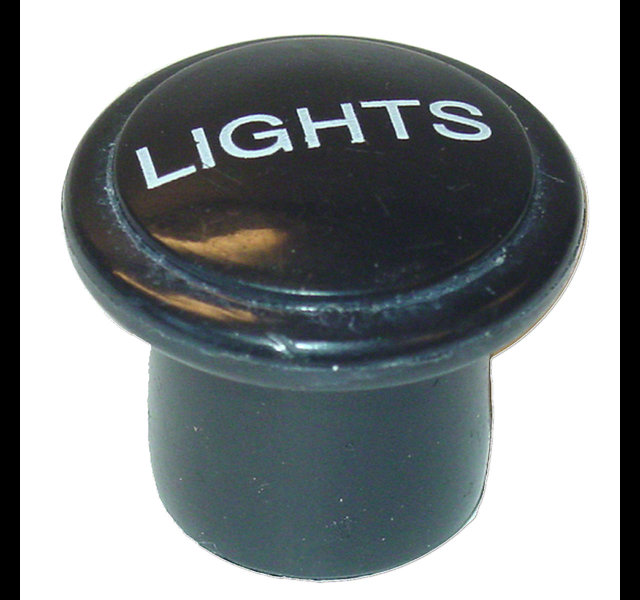 Knob for light switch. Says Light