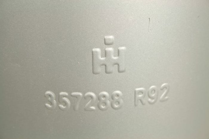 productphoto of Farmall muffler with IH logo and partnumber stamped on side